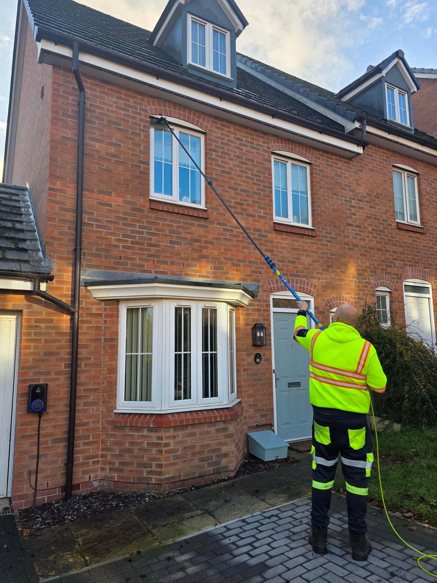 Water-fed pole window cleaning on a residential property